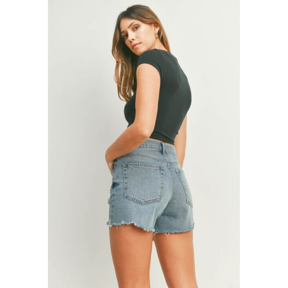 High Rise Distressed Denim Shorts blue back | MILK MONEY milkmoney.co | cute clothes for women. womens online clothing. trendy online clothing stores. womens casual clothing online. trendy clothes online. trendy women's clothing online. ladies online clothing stores. trendy women's clothing stores. cute female clothes.