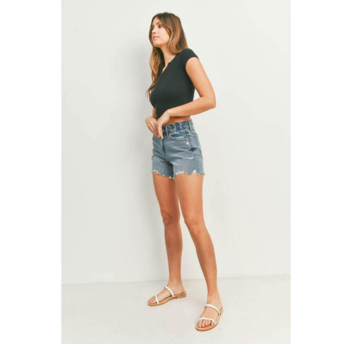 High Rise Distressed Denim Shorts blue side | MILK MONEY milkmoney.co | cute clothes for women. womens online clothing. trendy online clothing stores. womens casual clothing online. trendy clothes online. trendy women's clothing online. ladies online clothing stores. trendy women's clothing stores. cute female clothes.
