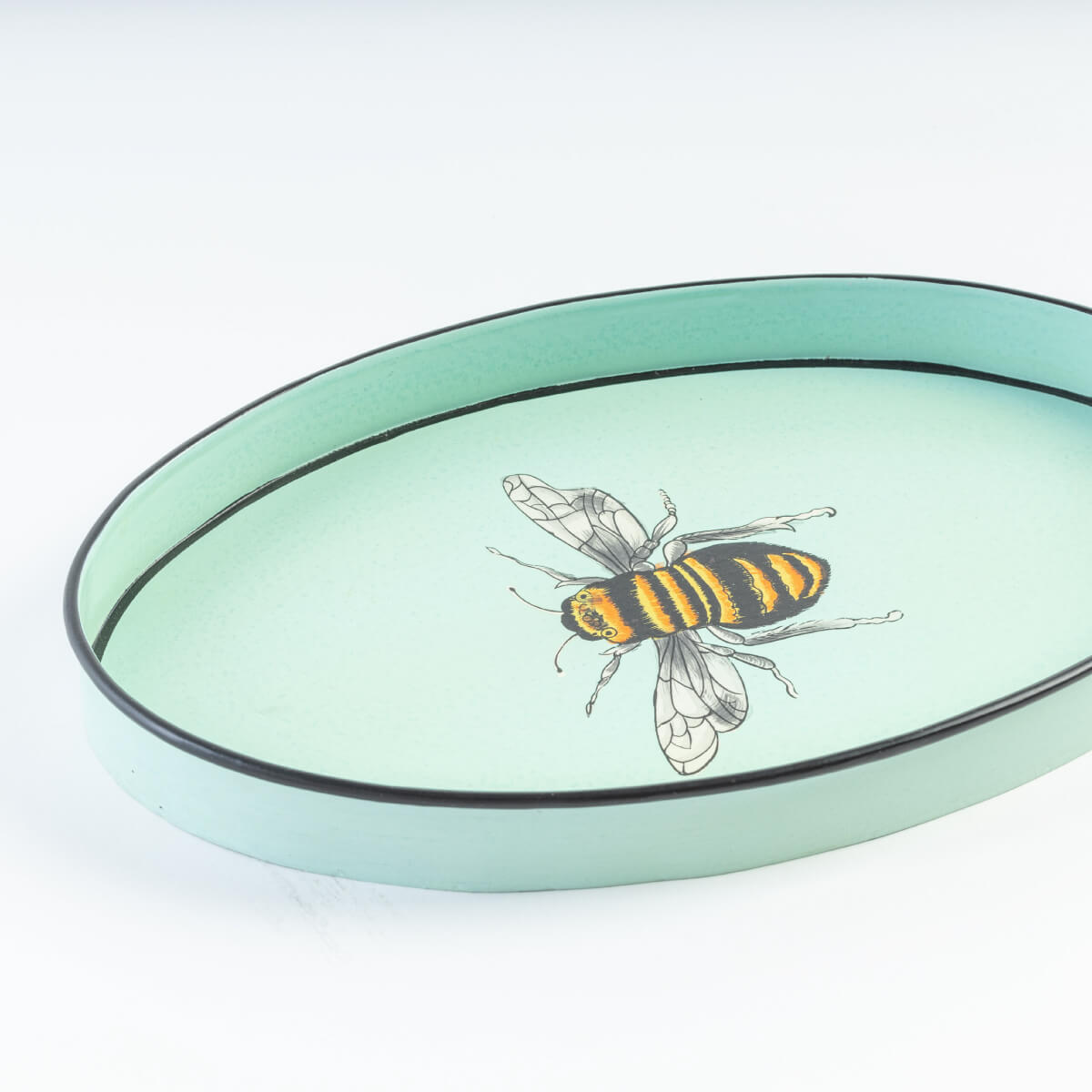 Les Ottomans Bee Hand Painted Oval Iron Tray blue front | MILK MONEY milkmoney.co | Home decor online, Modern home decor, Luxury home furnishings, Best home decor, Home accessories for sale, Living room furniture sets, Kitchen decor ideas, Wall art for home, Bathroom accessories, Vintage home decor, Minimalist home decor
