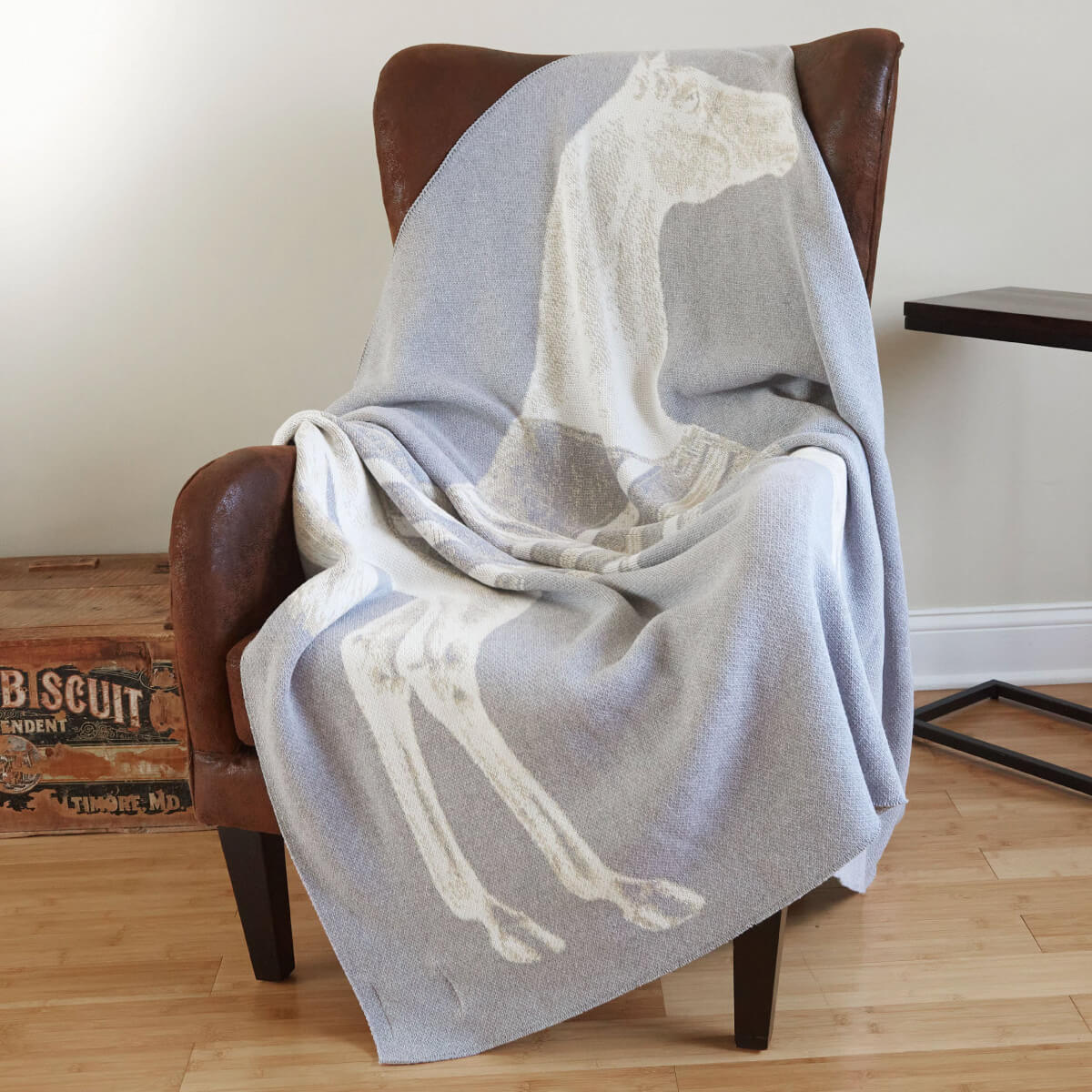 Thoroughbred Knit Throw lite grey lifestyle | MILK MONEY milkmoney.co | white elephant gift ideas, gift, mother's day gift ideas, white elephant gift, gift shops near me, cute home decor, mother's day gift, cute home accents, handmade in USA, elegant home decor