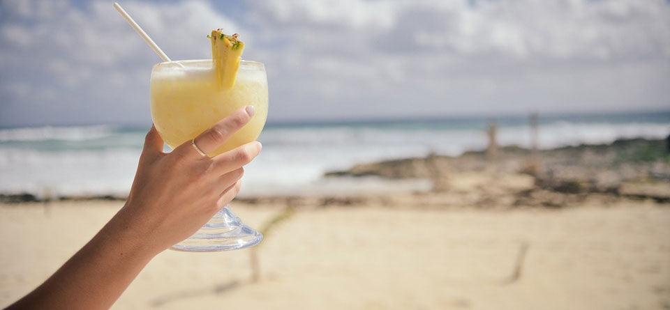 Woman’s hand holding a cocktail