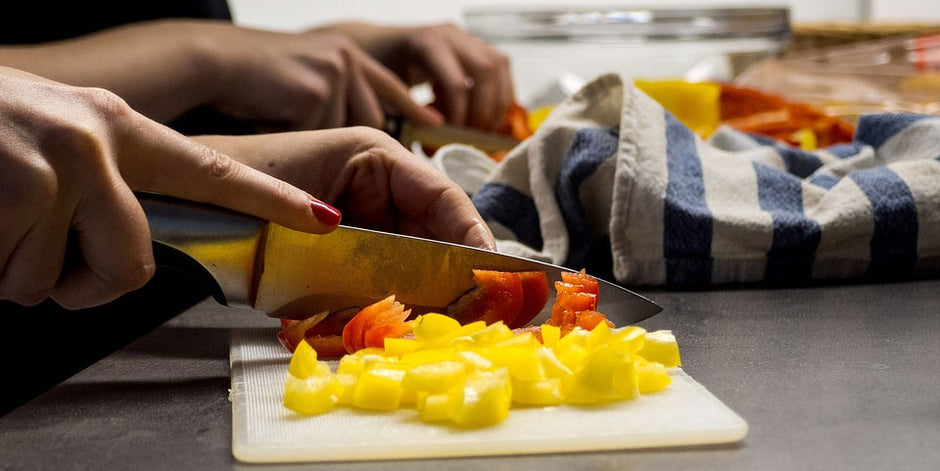 Woman chopping up vegetables