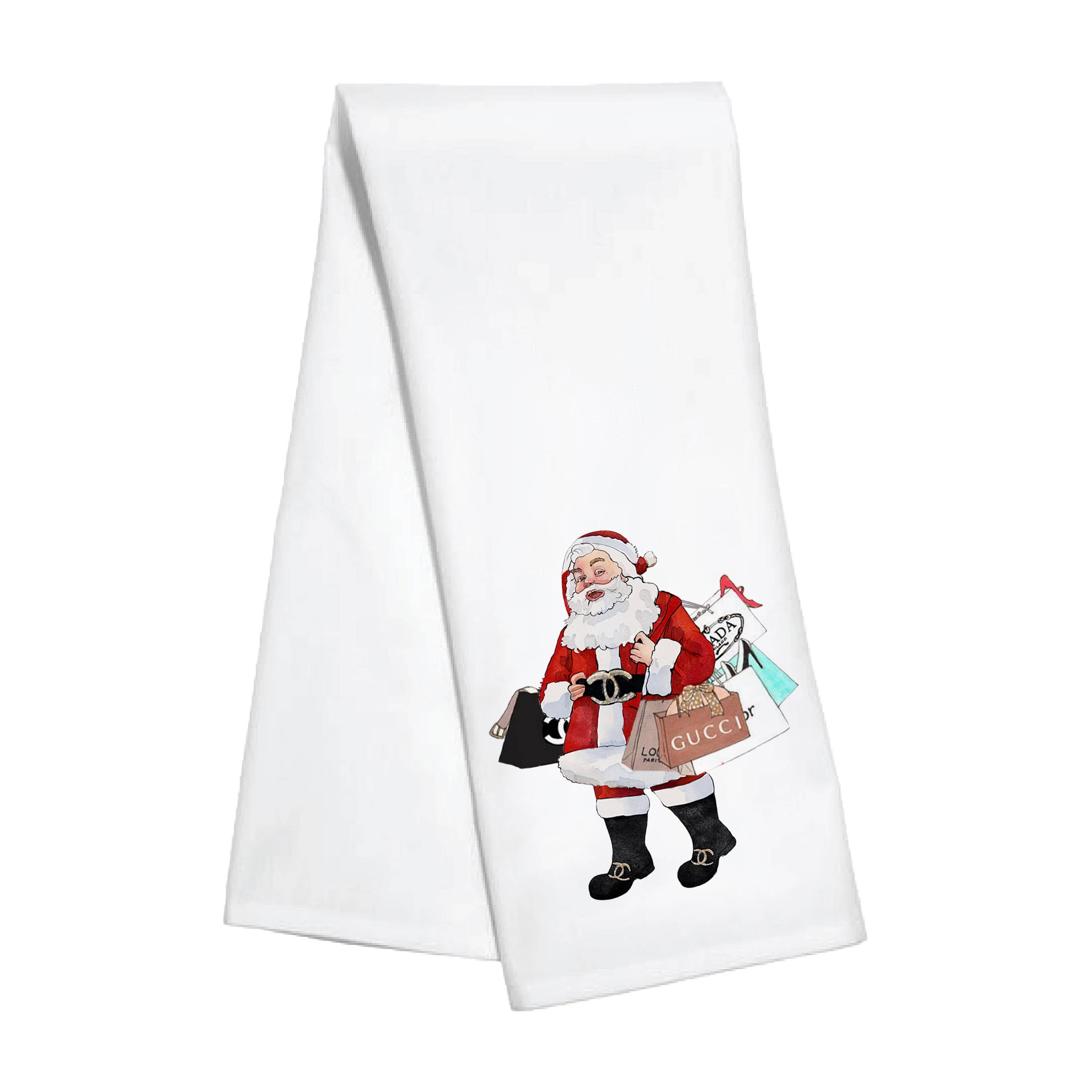 Shopping Santa Kitchen Towel front | MILK MONEY milkmoney.co | 	Home decor online, Modern home decor, Luxury home furnishings, Best home decor, Home accessories for sale, Living room furniture sets, Kitchen decor ideas, Wall art for home, Bathroom accessories, Vintage home decor, Minimalist home decor