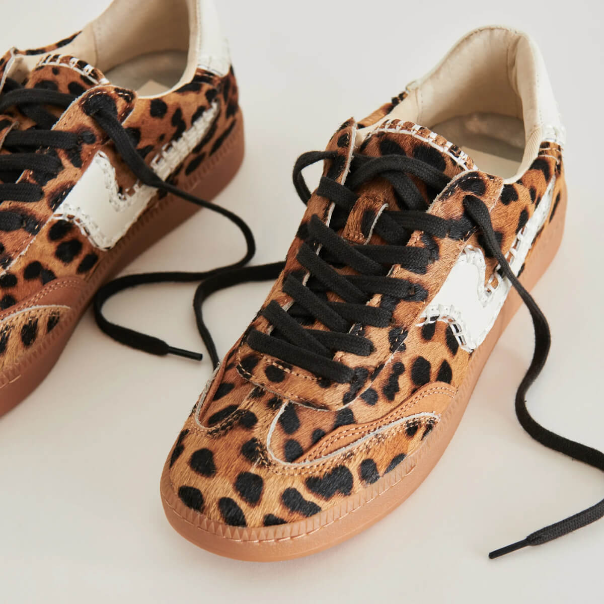 Dolce Vita Notice Stitch Sneakers leopard side | MILK MONEY milkmoney.co | cute shoes for women. ladies shoes. nice shoes for women. footwear for women. ladies shoes online. ladies footwear. womens shoes and boots. pretty shoes for women. beautiful shoes for women. 
