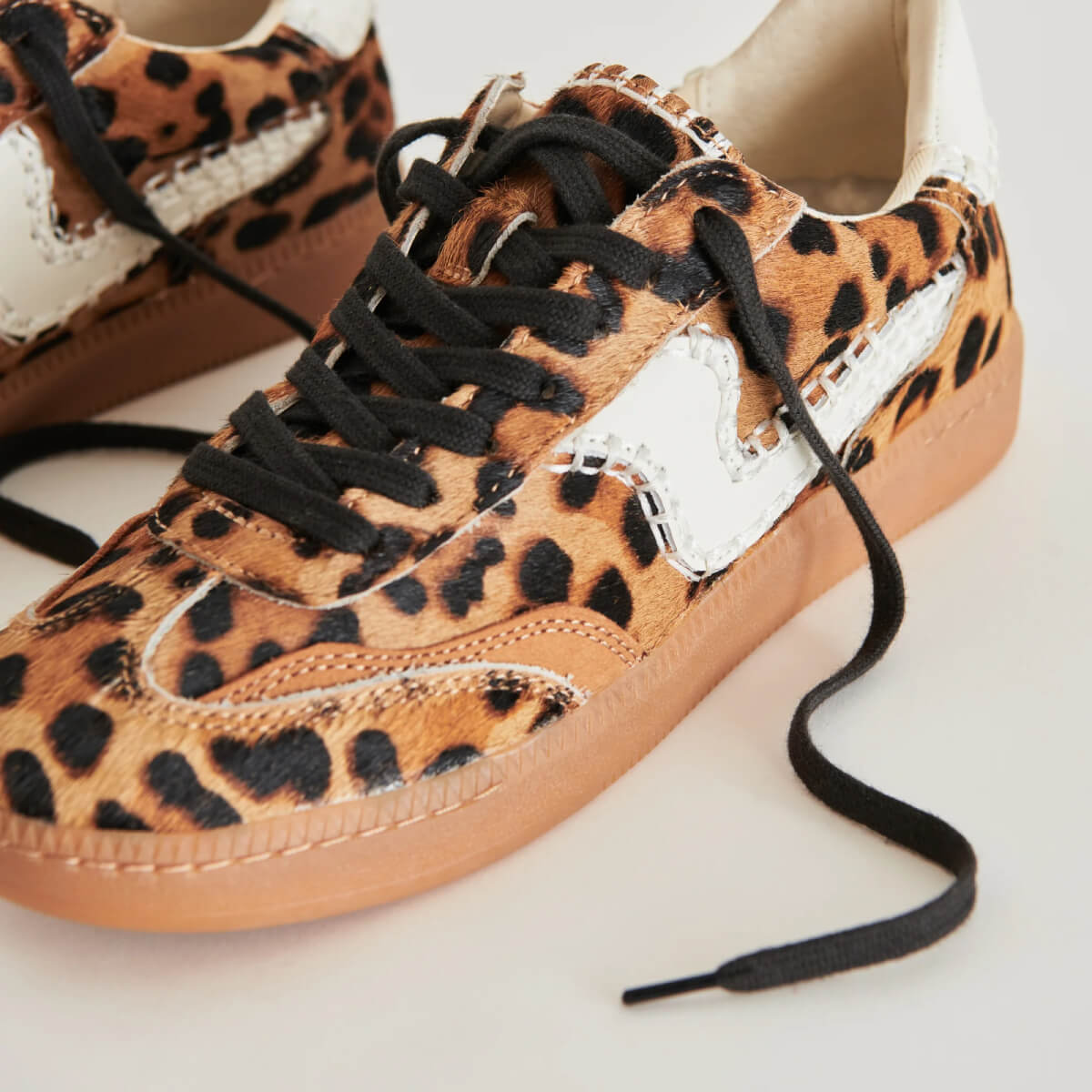 Dolce Vita Notice Stitch Sneakers leopard side | MILK MONEY milkmoney.co | cute shoes for women. ladies shoes. nice shoes for women. footwear for women. ladies shoes online. ladies footwear. womens shoes and boots. pretty shoes for women. beautiful shoes for women. 
