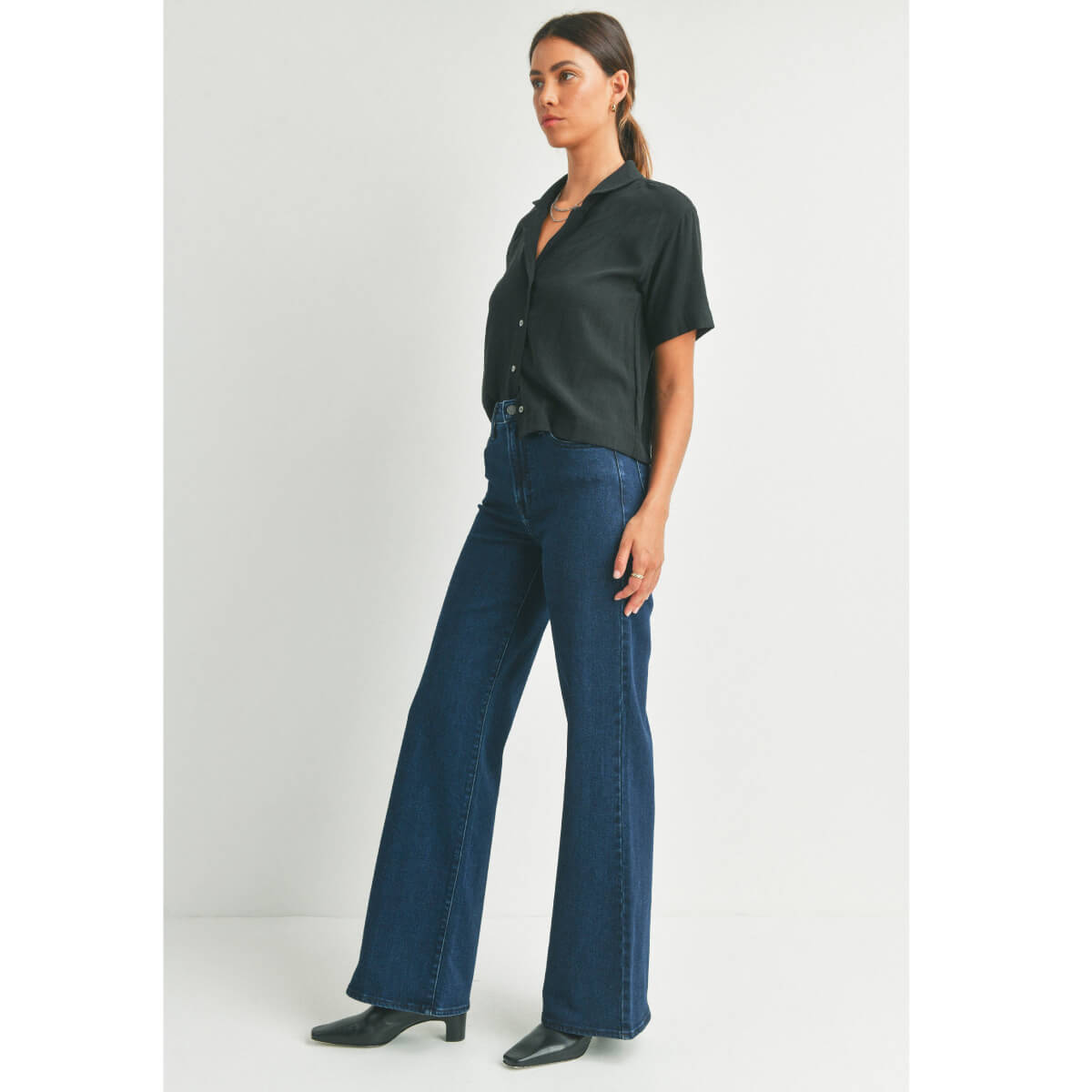 High Rise Dark Wash Palazzo Jeans blue side | MILK MONEY milkmoney.co | cute clothes for women. womens online clothing. trendy online clothing stores. womens casual clothing online. trendy clothes online. trendy women's clothing online. ladies online clothing stores. trendy women's clothing stores. cute female clothes.