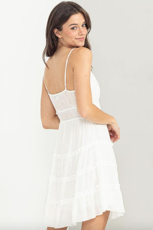 Lace Up Tiered Mini Dress white back | MILK MONEY milkmoney.co | cute clothes for women. womens online clothing. trendy online clothing stores. womens casual clothing online. trendy clothes online. trendy women's clothing online. ladies online clothing stores. trendy women's clothing stores. cute female clothes.