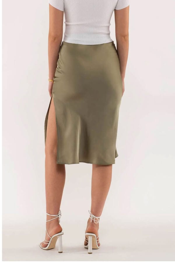 Side Slit Satin Skirt olive back | MILK MONEY milkmoney.co | cute clothes for women. womens online clothing. trendy online clothing stores. womens casual clothing online. trendy clothes online. trendy women's clothing online. ladies online clothing stores. trendy women's clothing stores. cute female clothes.