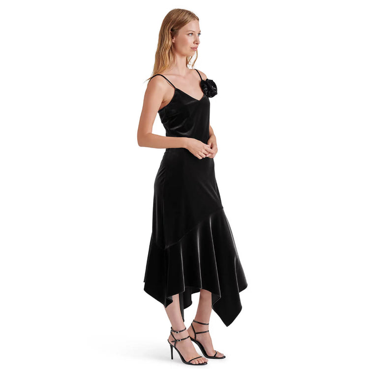 Steve Madden Lucille Velvet Rosette Midi Dress black side | MILK MONEY milkmoney.co | cute clothes for women. womens online clothing. trendy online clothing stores. womens casual clothing online. trendy clothes online. trendy women's clothing online. ladies online clothing stores. trendy women's clothing stores. cute female clothes.
