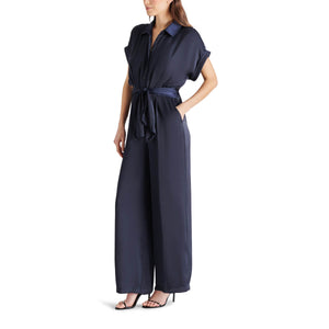 Steve Madden Tori Tie Waist Wide Leg Satin Jumpsuit navy side | MILK MONEY milkmoney.co | cute clothes for women. womens online clothing. trendy online clothing stores. womens casual clothing online. trendy clothes online. trendy women's clothing online. ladies online clothing stores. trendy women's clothing stores. cute female clothes.