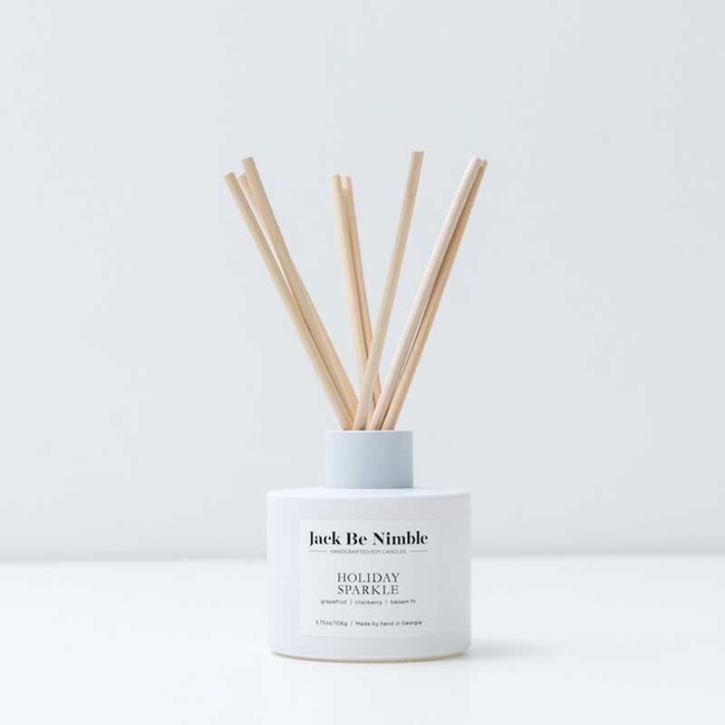 Holiday Sparkle Reed Diffuser white front | MILK MONEY milkmoney.co | soy wax candles. small candles. natural candles. organic candles. scented soy candles. concrete candle. hand poured candles. hand poured soy candles. cement candle. hand poured soy wax candles. scented hand poured candles. hand poured scented candles.