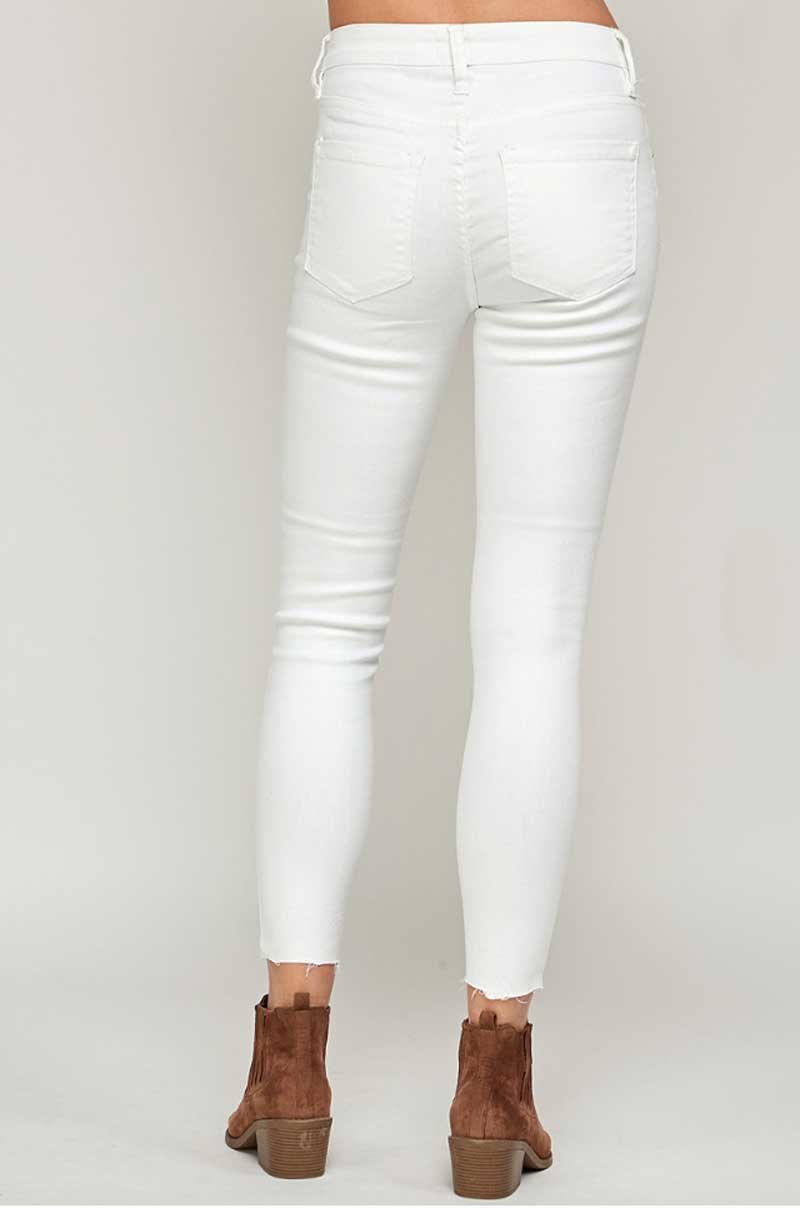 Mid Rise White Raw Hem Classic Skinny Jeans back | MILK MONEY milkmoney.co | cute clothes for women. womens online clothing. trendy online clothing stores. womens casual clothing online. trendy clothes online. trendy women's clothing online. ladies online clothing stores. trendy women's clothing stores. cute female clothes.
