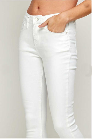 Mid Rise White Raw Hem Classic Skinny Jeans detail | MILK MONEY milkmoney.co | cute clothes for women. womens online clothing. trendy online clothing stores. womens casual clothing online. trendy clothes online. trendy women's clothing online. ladies online clothing stores. trendy women's clothing stores. cute female clothes.