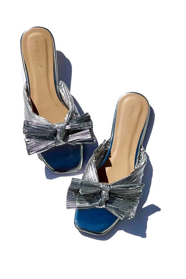 Pleated Metallic Bow Flat Sandal silver top | MILK MONEY milkmoney.co | cute sandals for women. cute slides for women. trendy womens sandals. women sandals online. pretty sandals for women. cute slides womens.