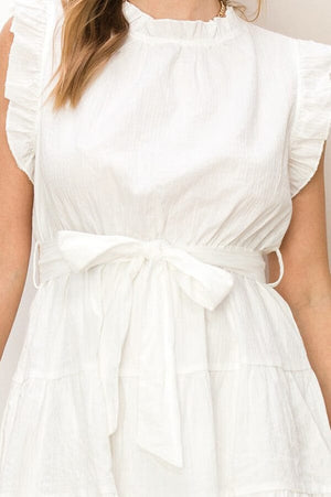 Ruffled Mini Tiered Dress white detail | MILK MONEY milkmoney.co | cute clothes for women. womens online clothing. trendy online clothing stores. womens casual clothing online. trendy clothes online. trendy women's clothing online. ladies online clothing stores. trendy women's clothing stores. cute female clothes.